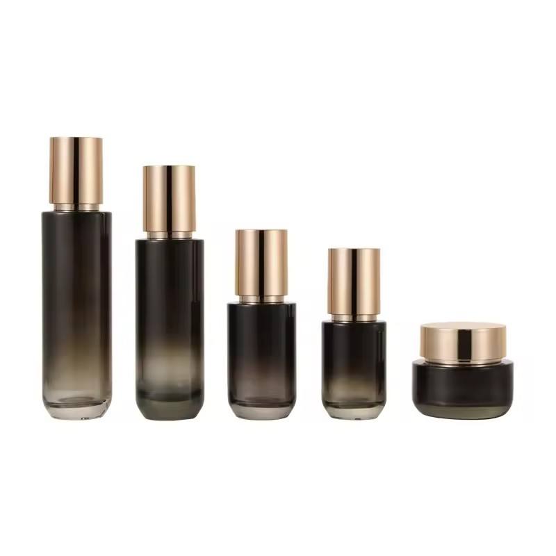 Luxury Beautiful Black Glass Cosmetics Packaging Set Gold Lid Set Face Cream Jars Lotion Bottle With Paper Tube