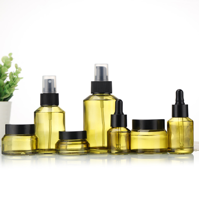 Olive green slanted shoulder glass skin care packaging essential oil bottle and spray lotion bottle