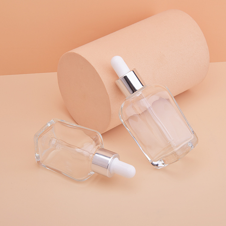 Manufacturer 15/30/50ml essence liquid bottle transparent glass thick wall cosmetics package press eye cream dropper bottle